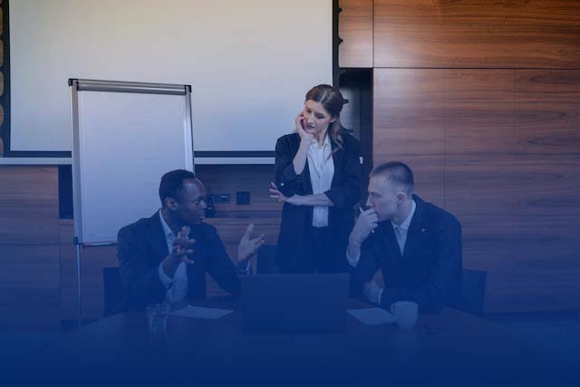 Photo by Alena Darmel: https://www.pexels.com/photo/men-in-black-suit-jacket-sitting-beside-woman-in-black-blazer-standing-8134001/